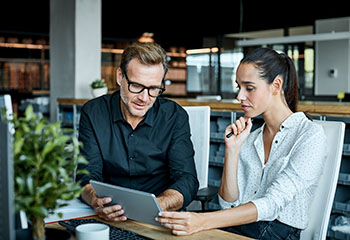 two people looking at tablet