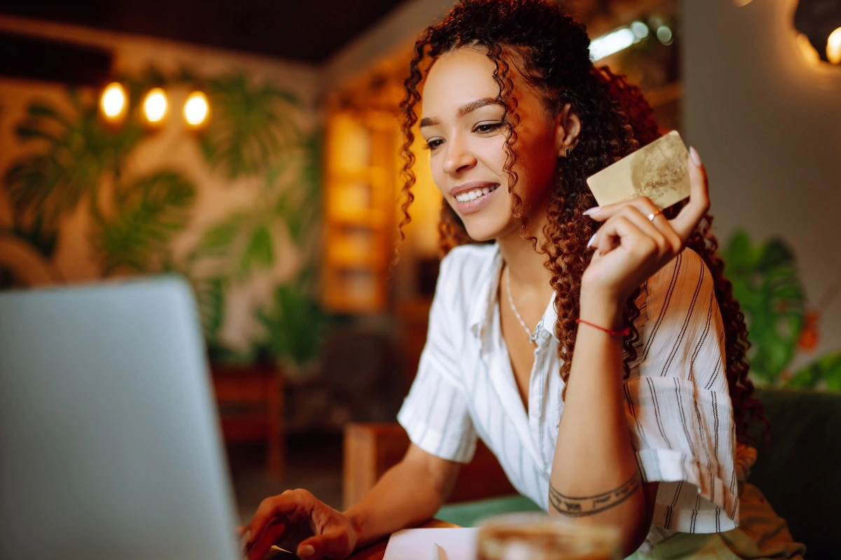 Image of woman using a credit card online