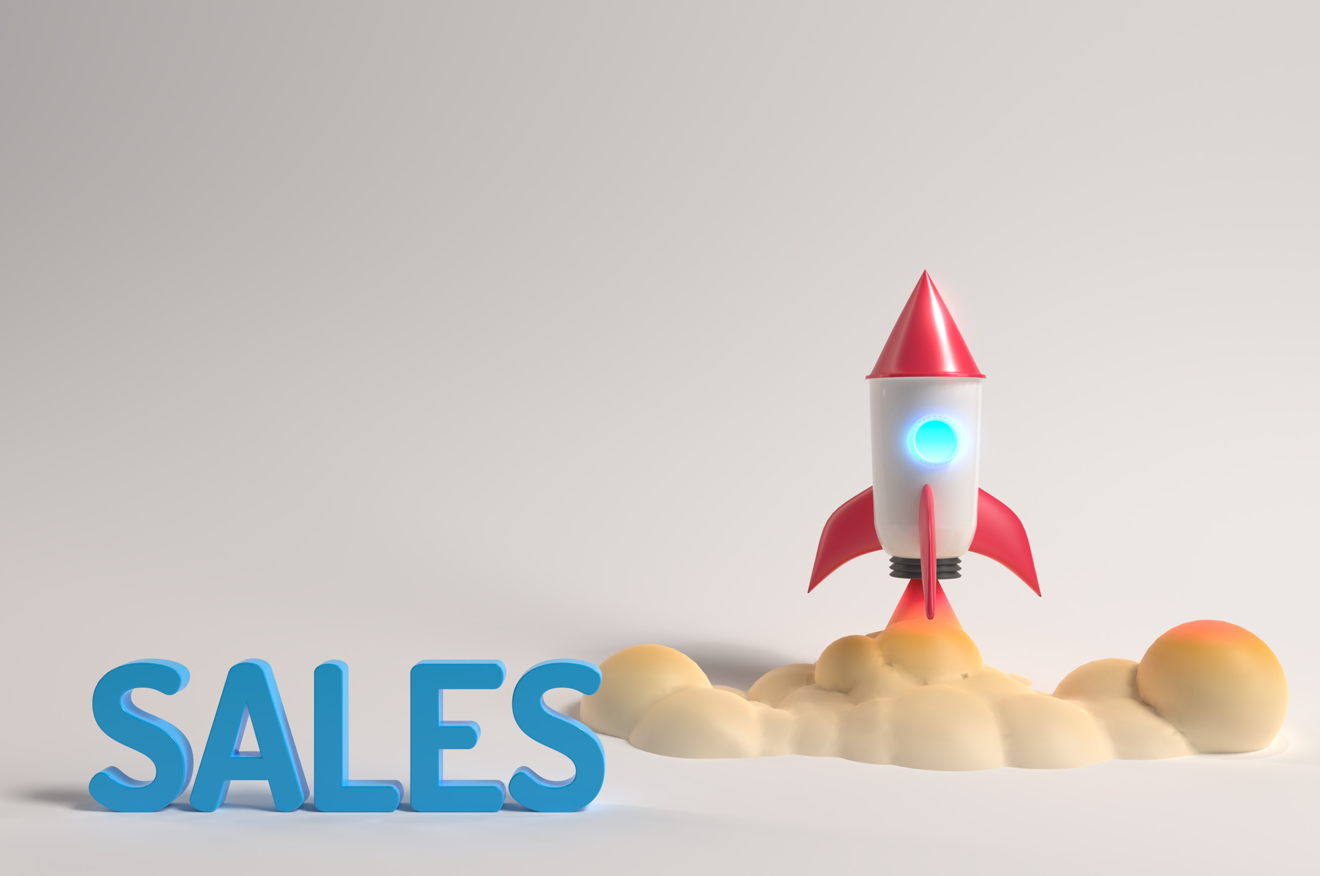 Image of the word Sales and a toy rocket in the back