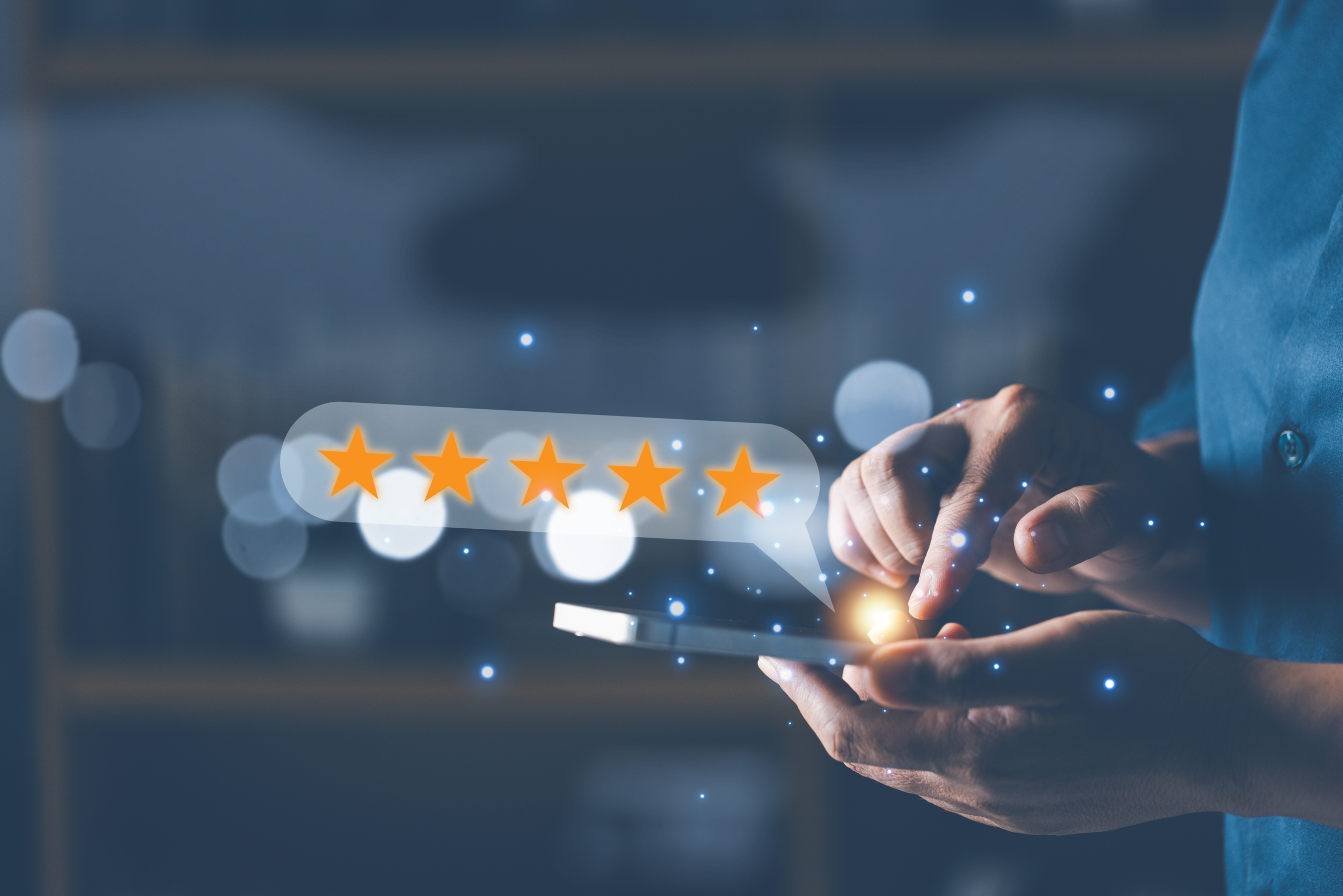 Hand holding five superimposed stars symbolizing customer ratings