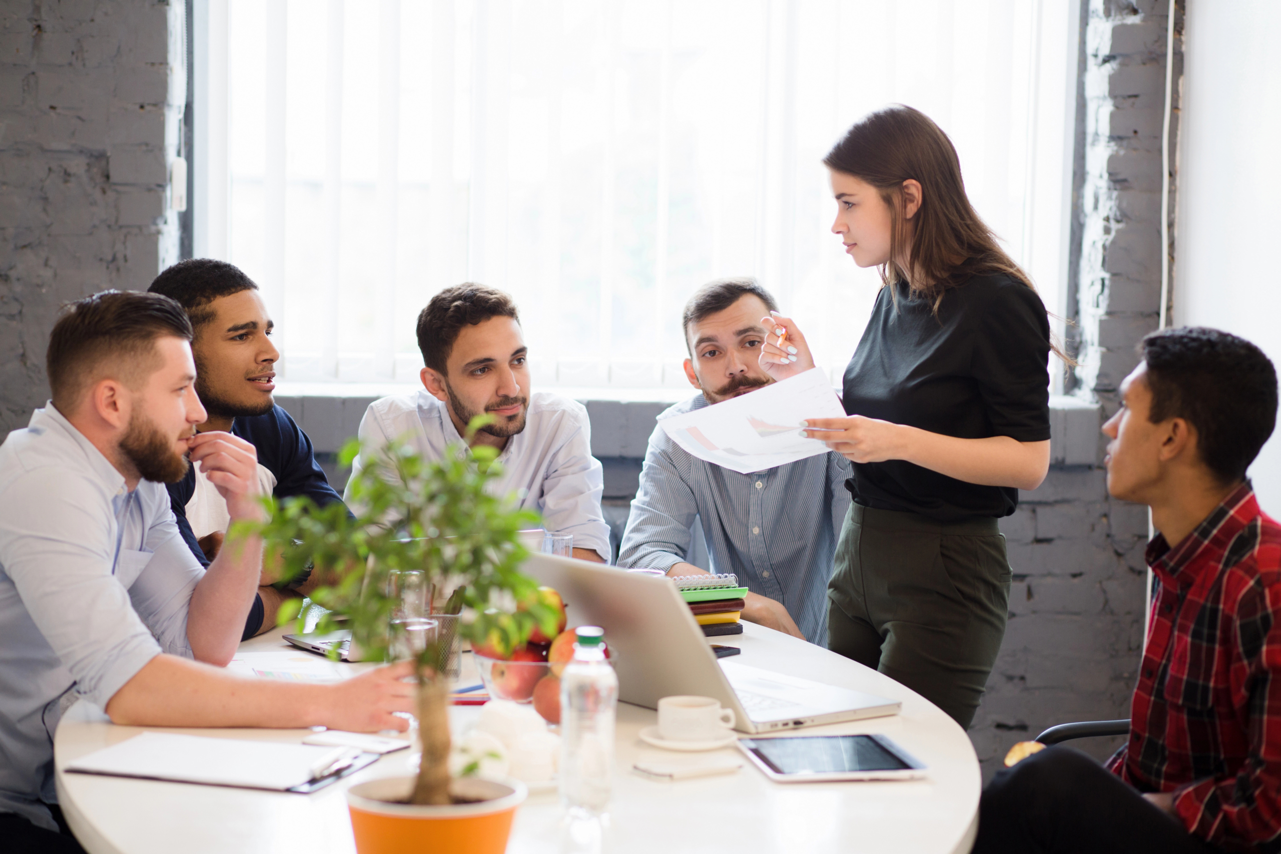 businesspeople using B2B lead generation services in an office.