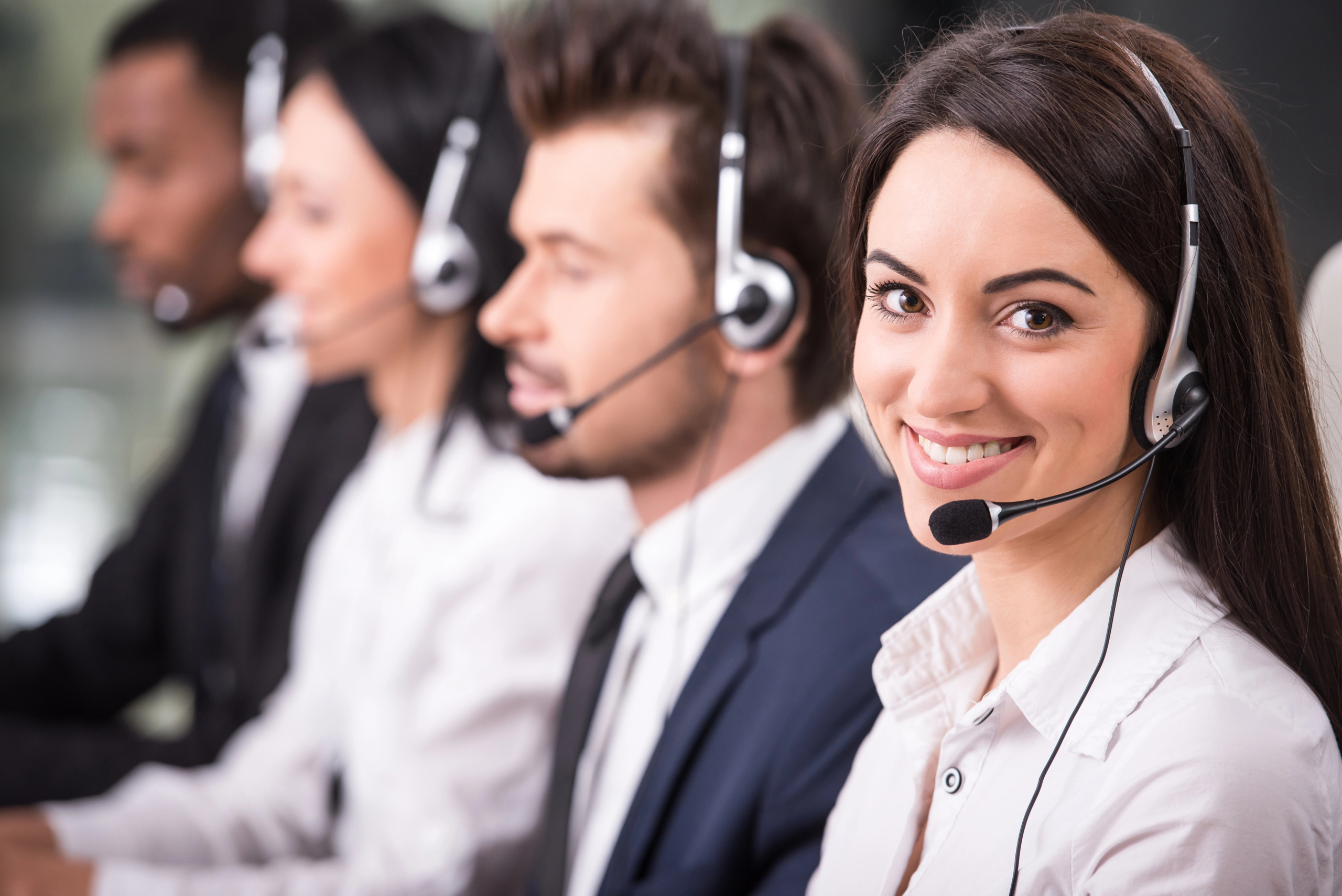 people working in a call center for a business that’s contact center outsourcing