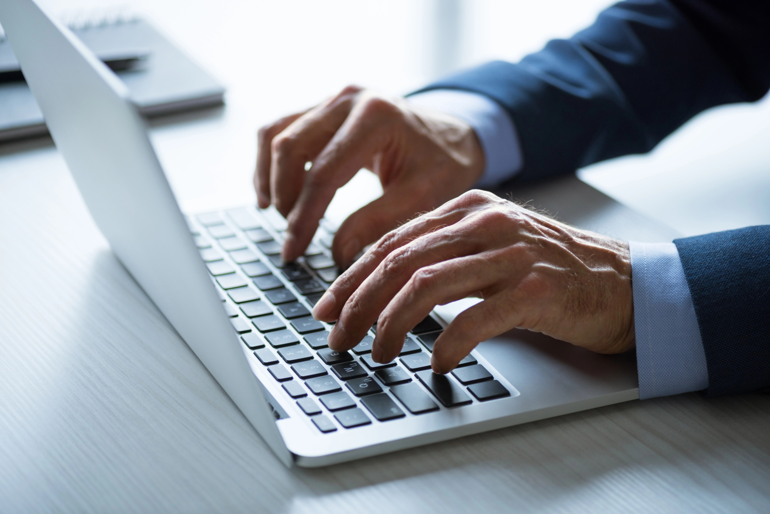 businessman working on customer acquisition with laptop