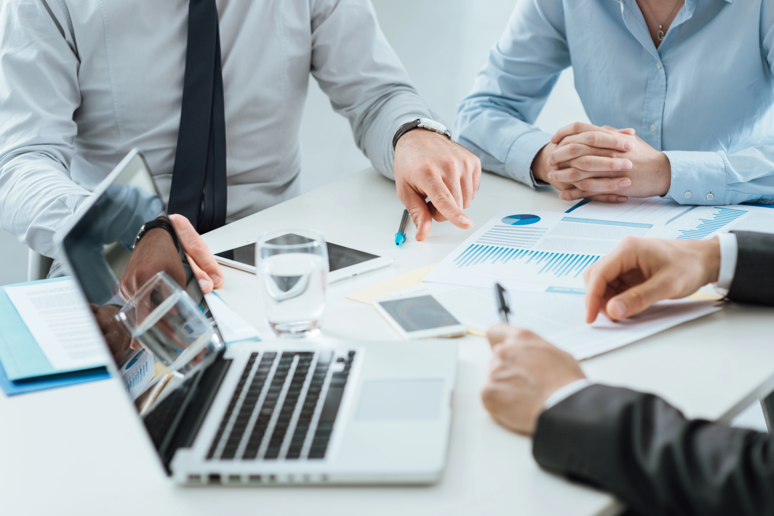 sales team sits in office and reviews results after taking advantage of B2B intent data